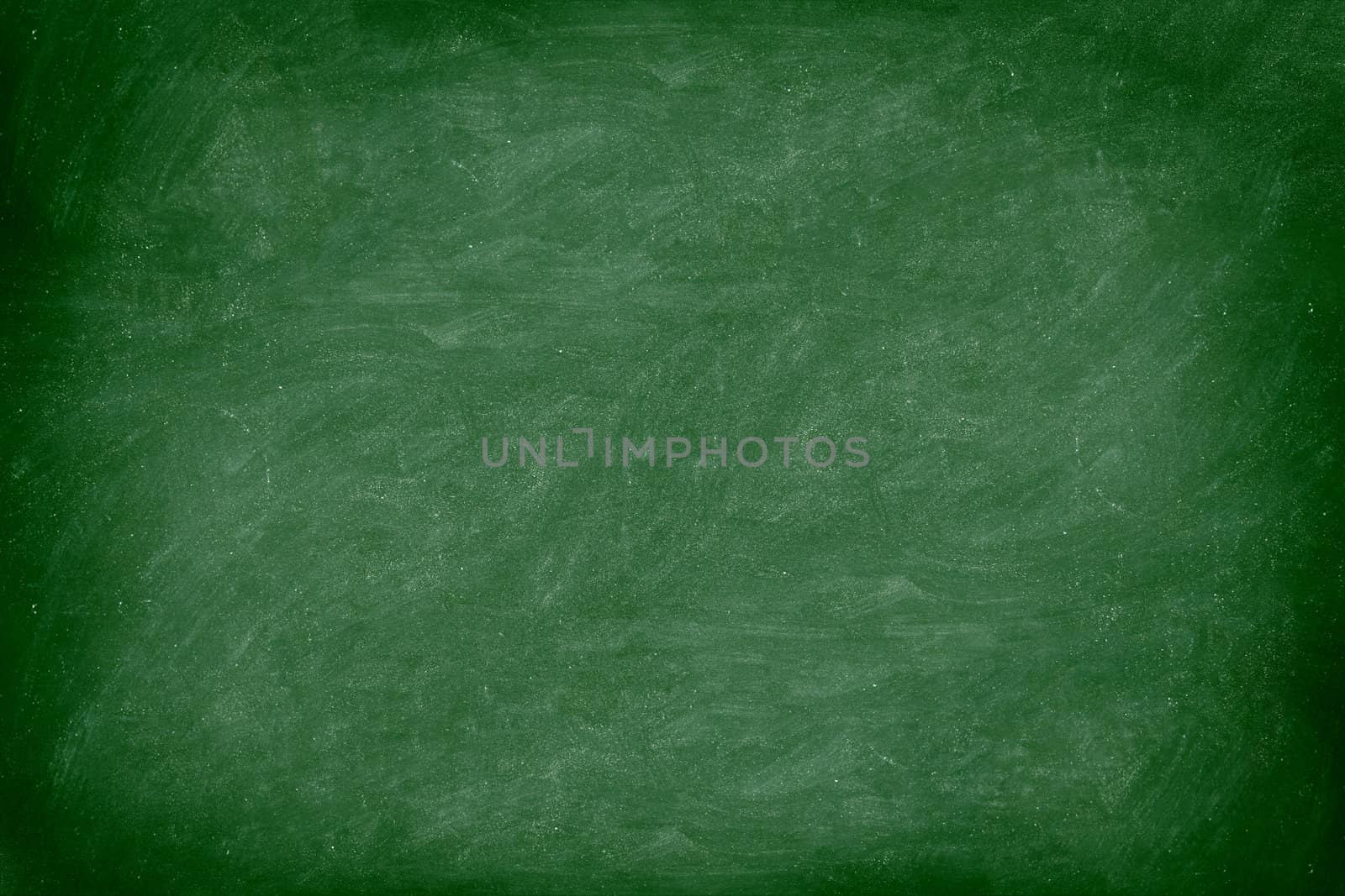 Chalkboard / blackboard green. Empty blank with copy space for chalk text. Used feel with chalk traces and great texture. From Photo.