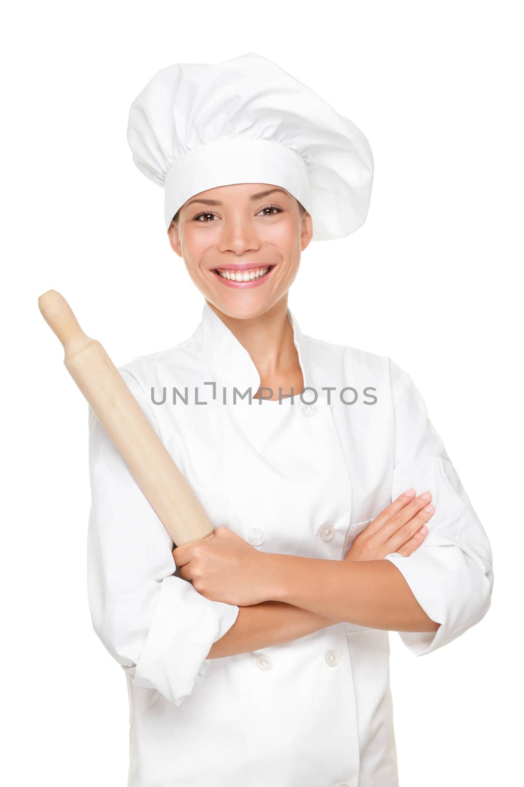 Baker / Chef woman smiling happy holding baking rolling pin wearing uniform isolated on white background. Beautiful young mixed race Asian Caucasian female model with arms crossed standing proud and confident.