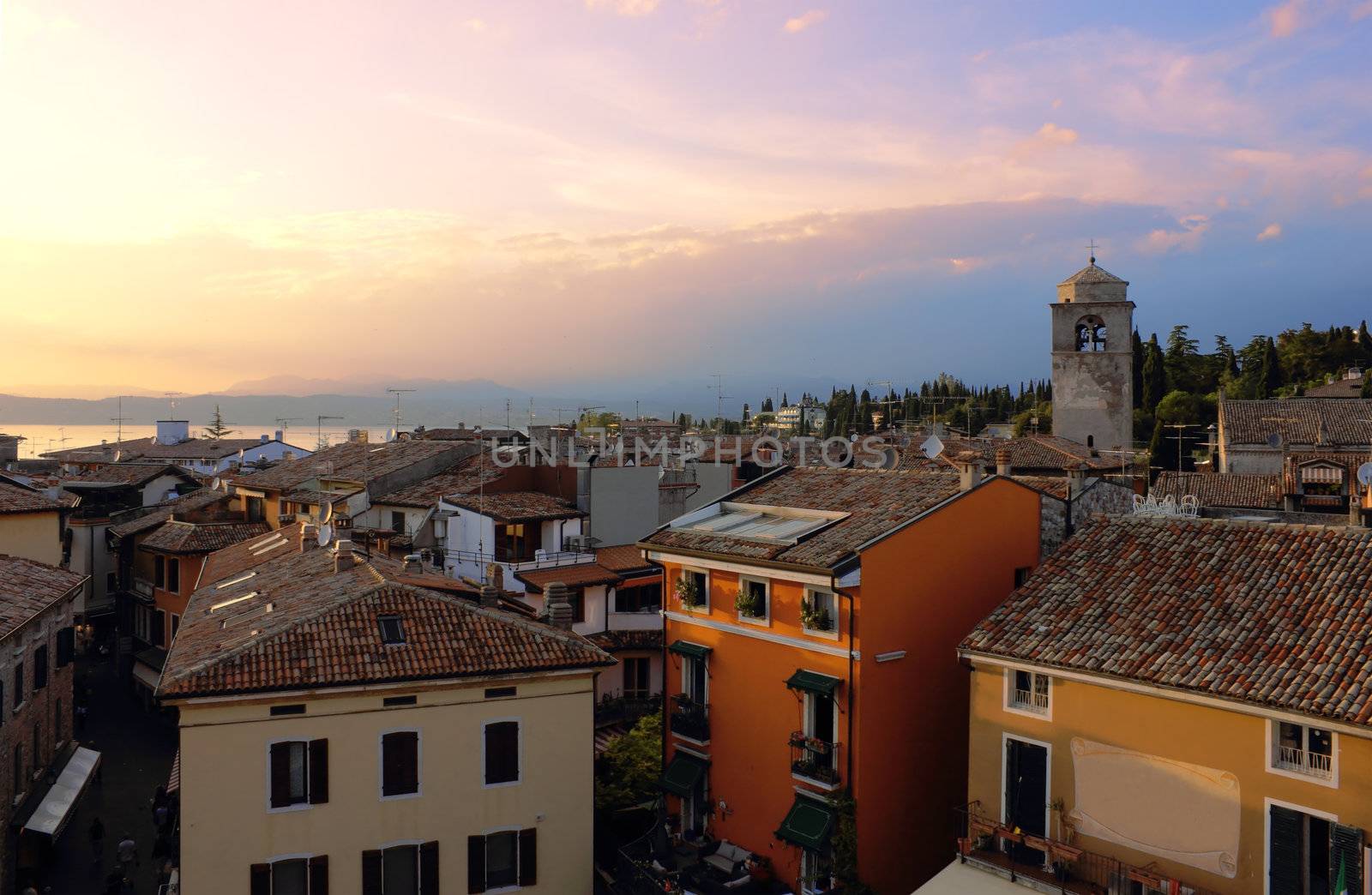 Early evening view of Sirmione in the warm light of the sunset with Lago di Garda at the background.