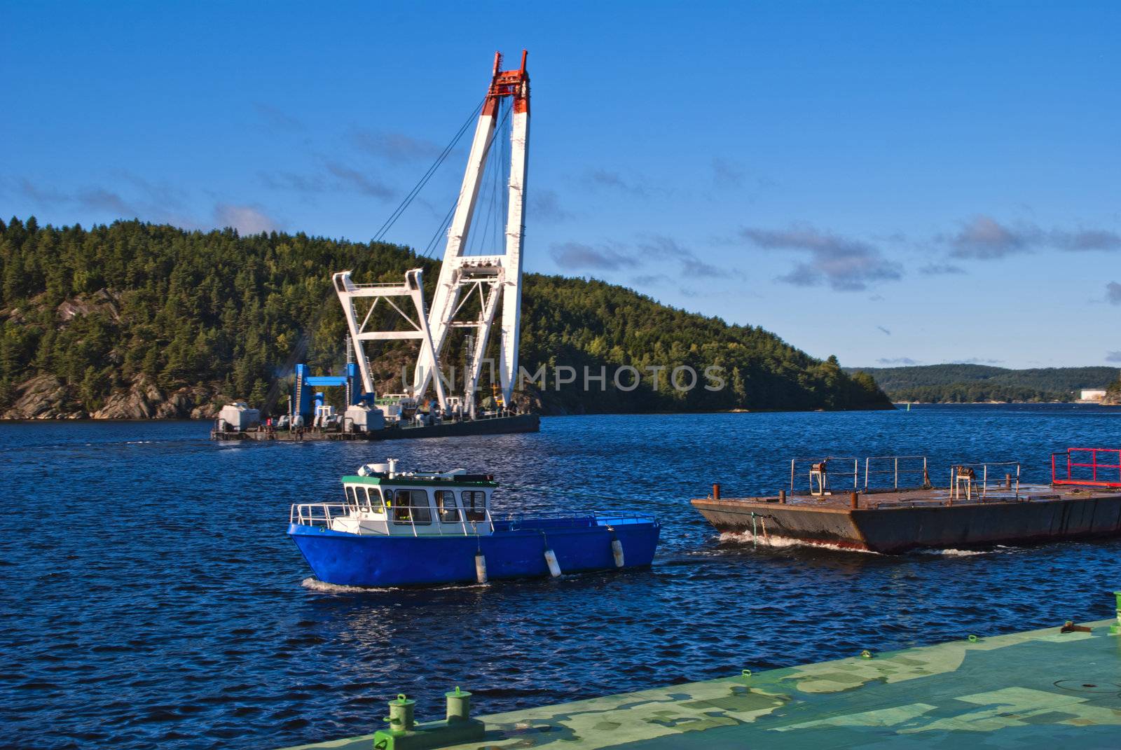 floating crane departs from the port of halden by steirus