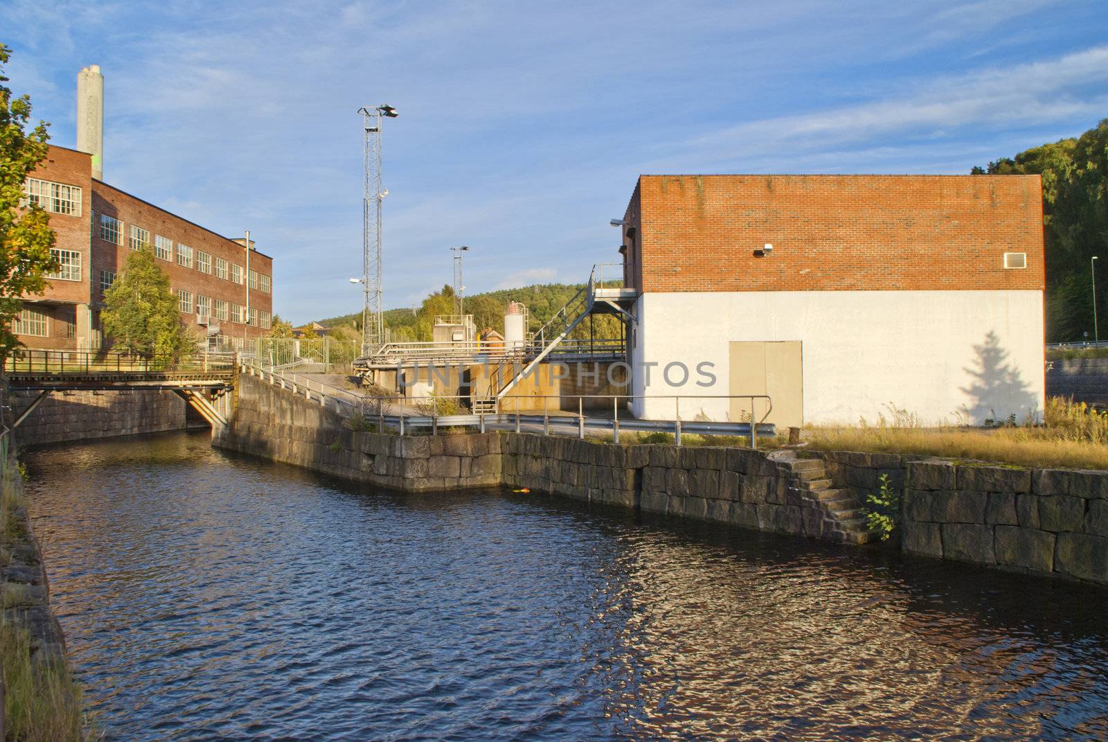 paper mill in Halden (Norway) which is the oldest wood processing plant in Norway, image is shot from the Tista river that flows past the factory. 