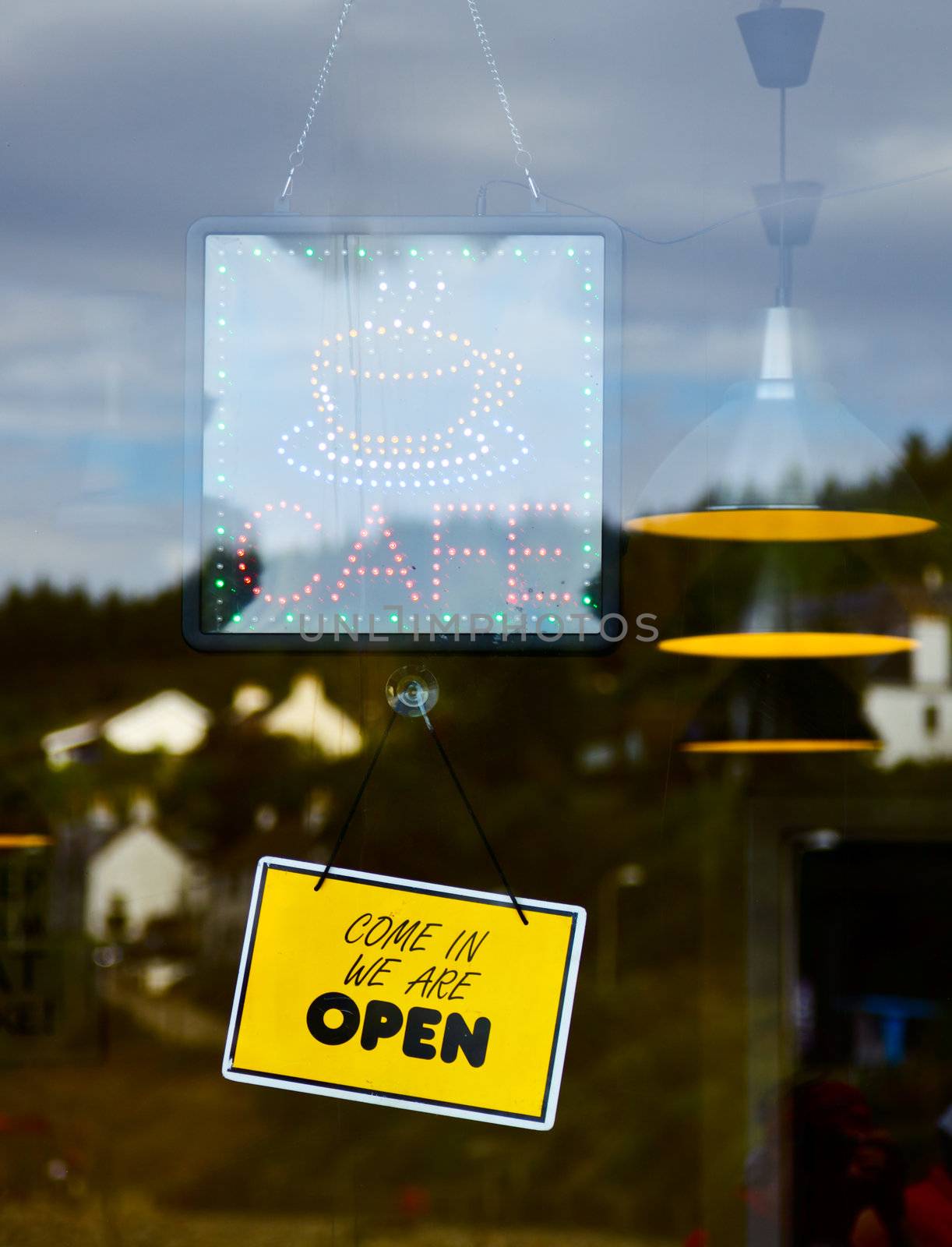 Glowing LED Cafe sign on a window