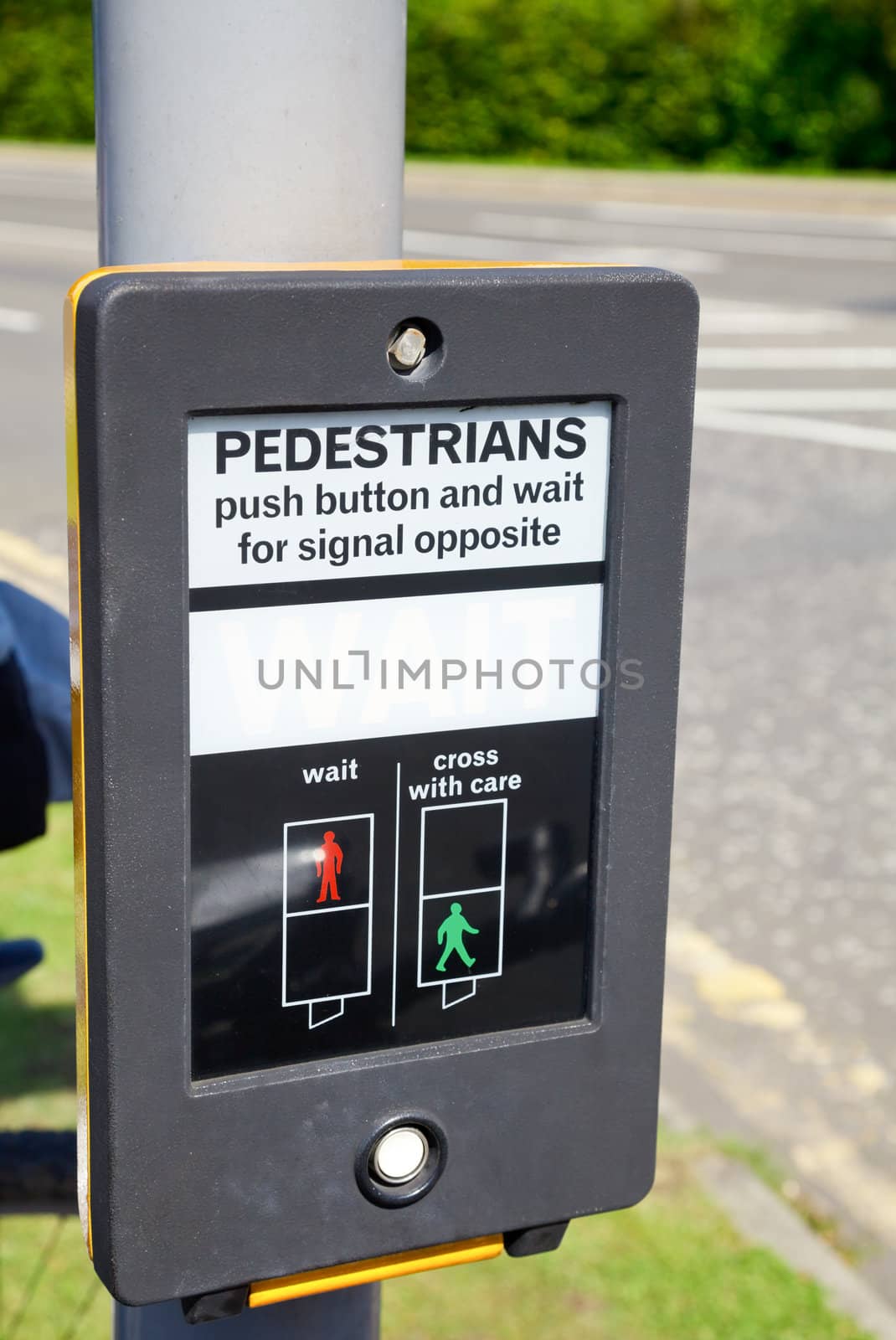 British pedestrian crossing button with wait sign