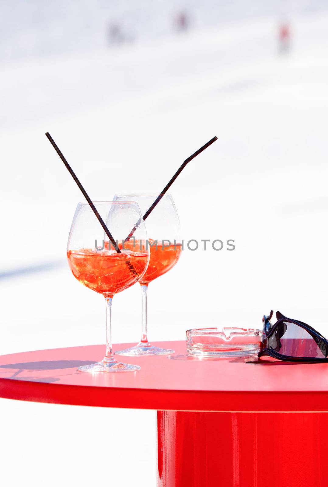 Champagne cocktails on a red table at Italian ski resort