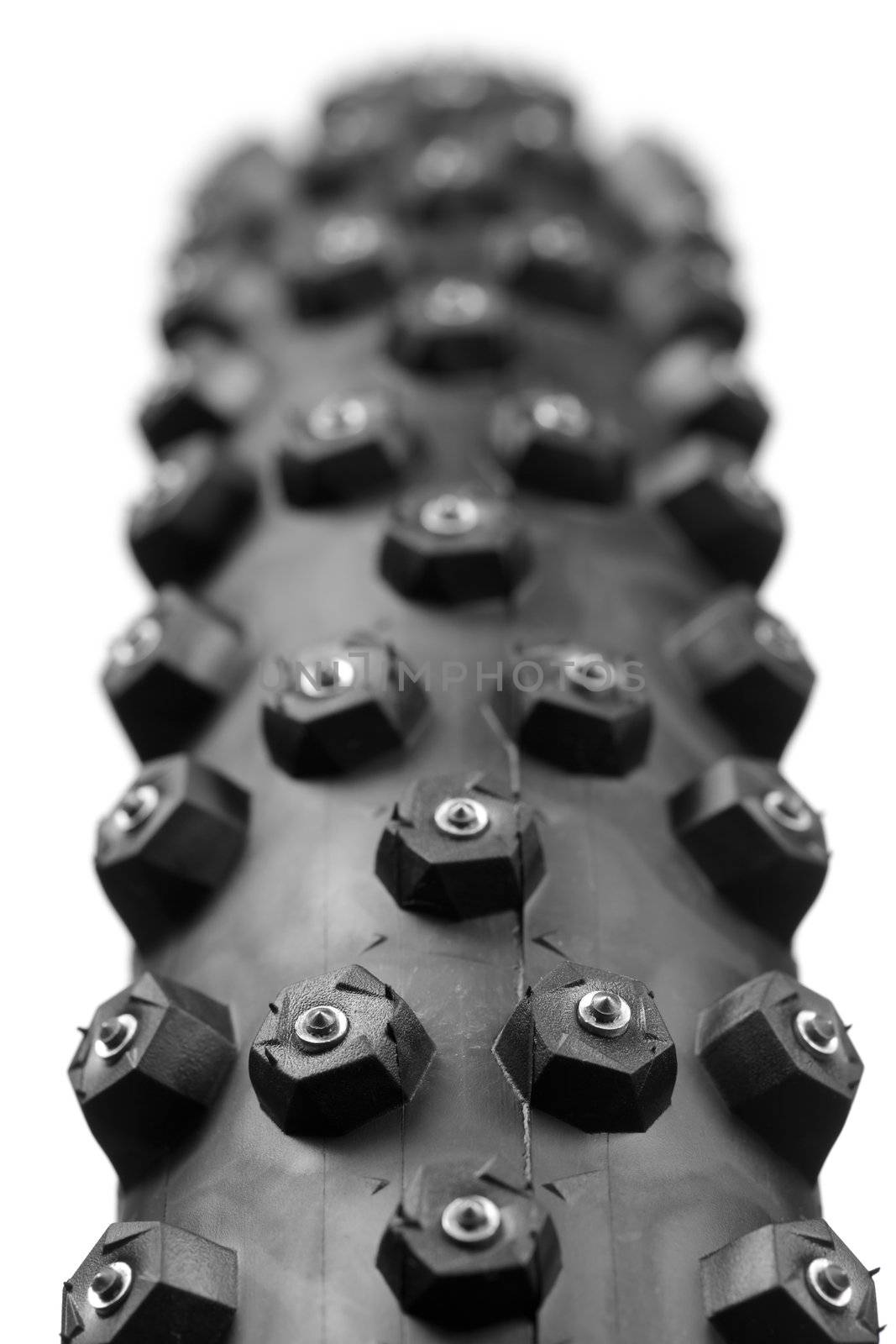 Knobby mountain bike winter tire with spikes close-up