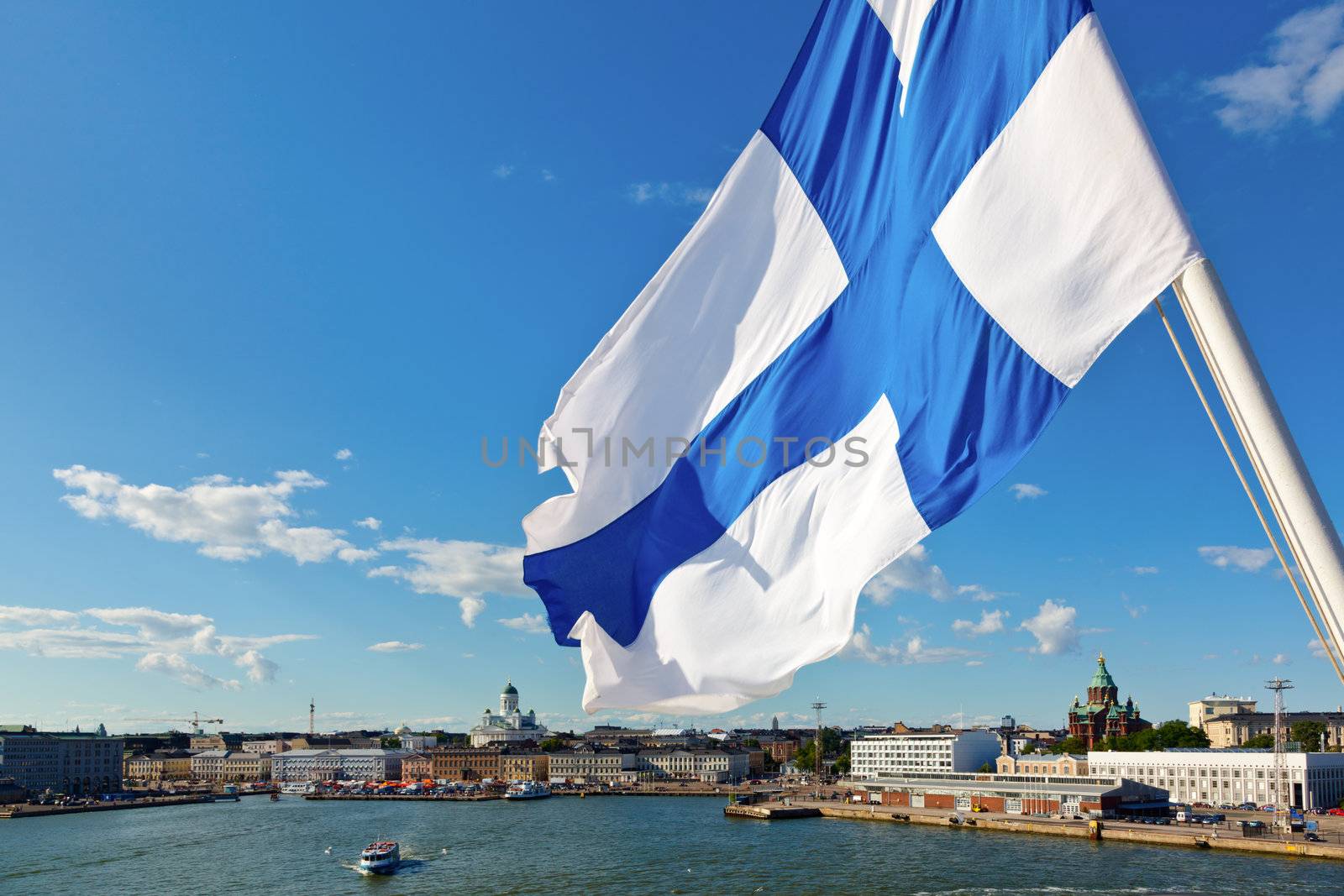 Flag of Finland against Helsinki panorama