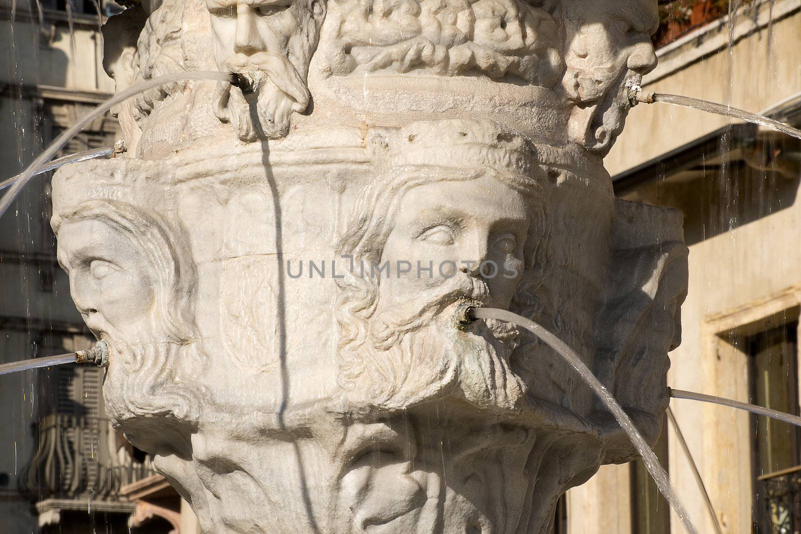 Detail of the fountain of Madonna Verona with heads of kings in Verona - Italy