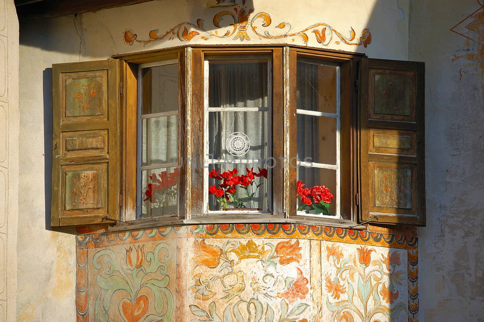 Detail of a typical window with decorations in Engadine - Switzerland