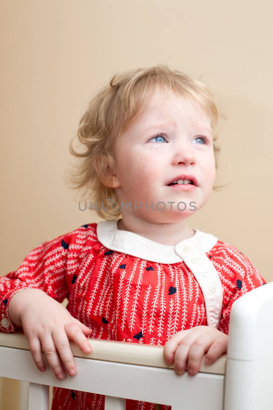 Portrait of sad little girl with tear in her eye