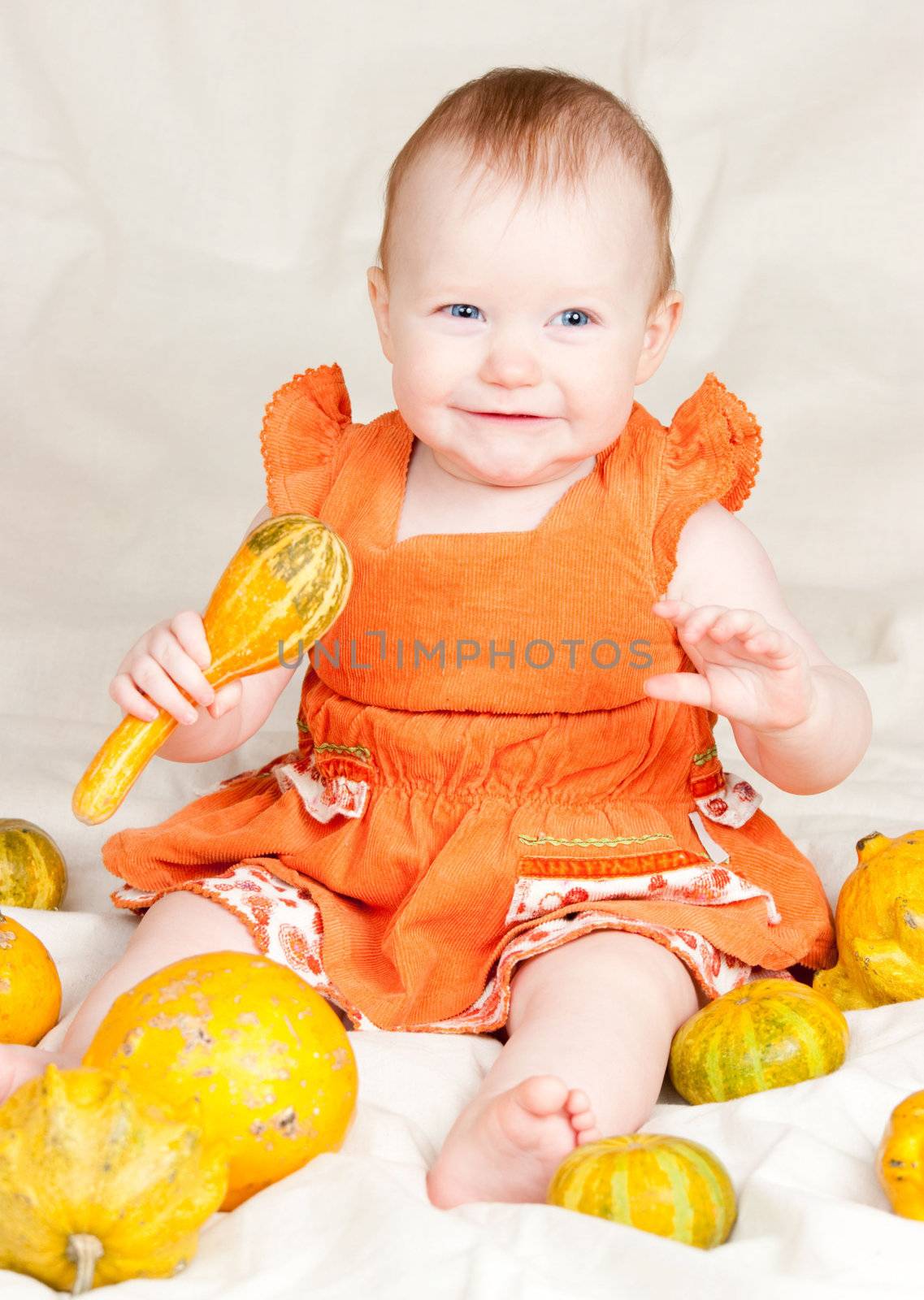 Infant with pumpkins by naumoid