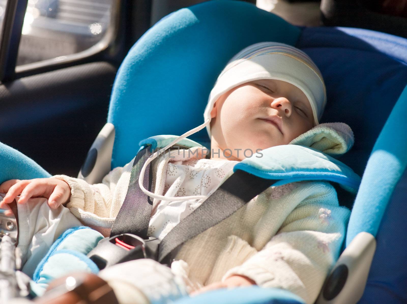 Toddler sleeping in a car seat