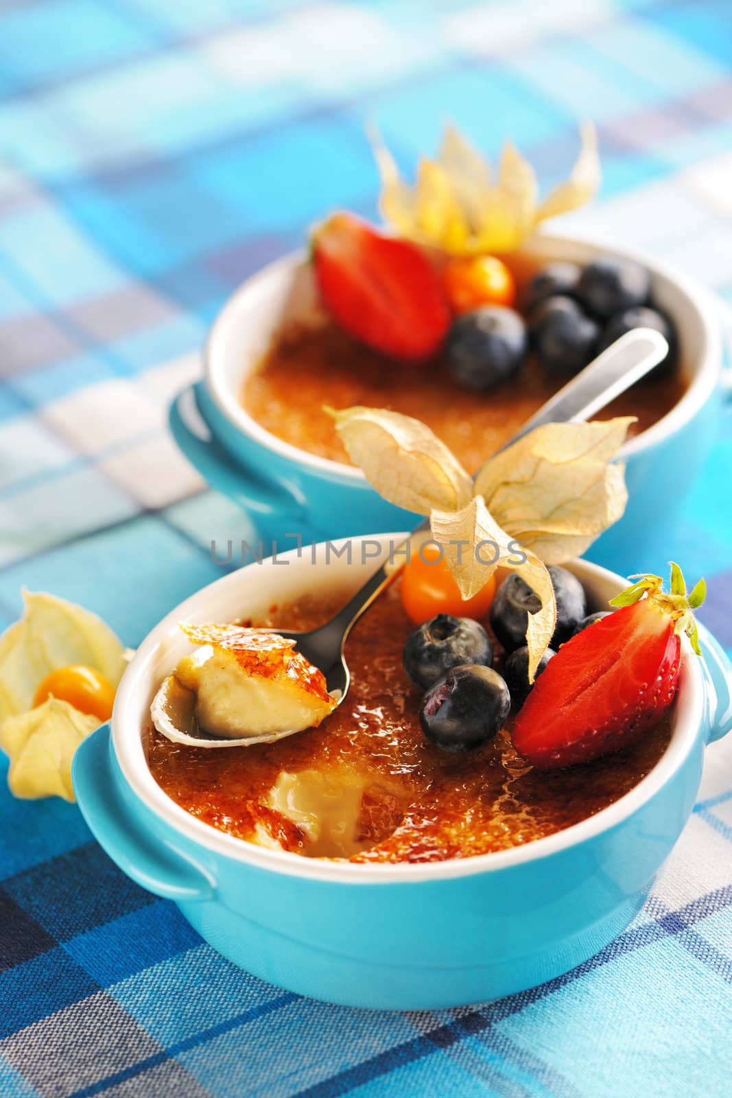 Creme brulee (cream brulee, burnt cream) with fruits and berries