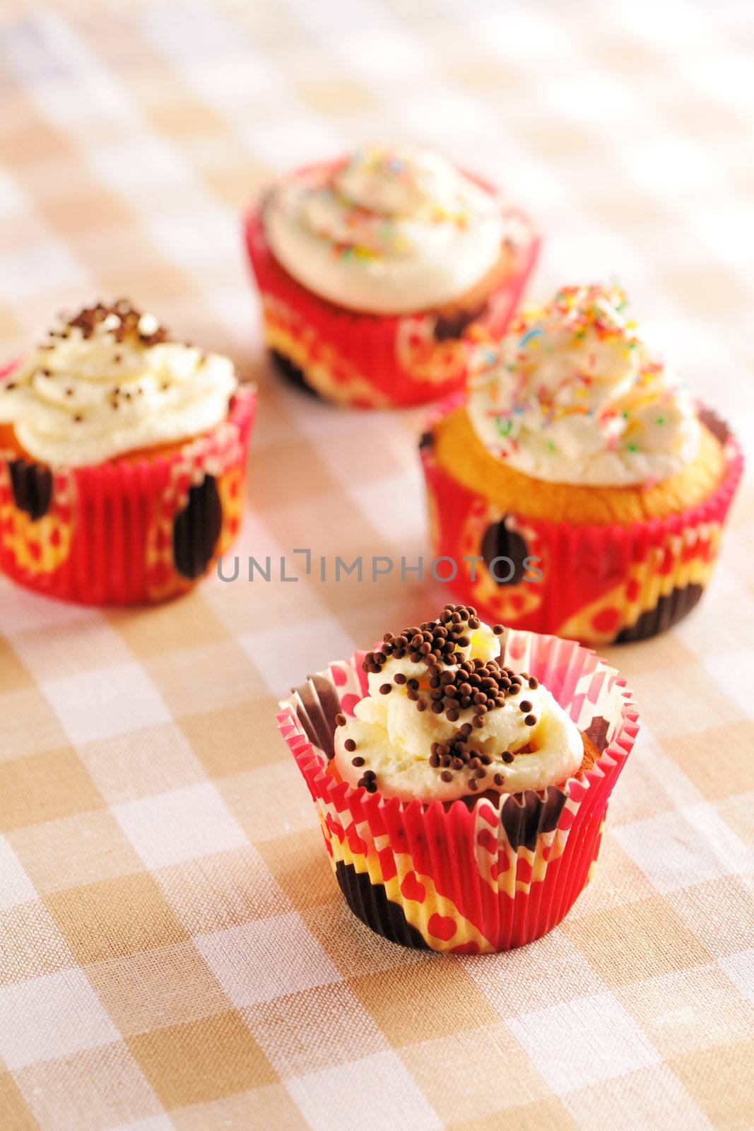 Cupcakes with whipped cream and icing