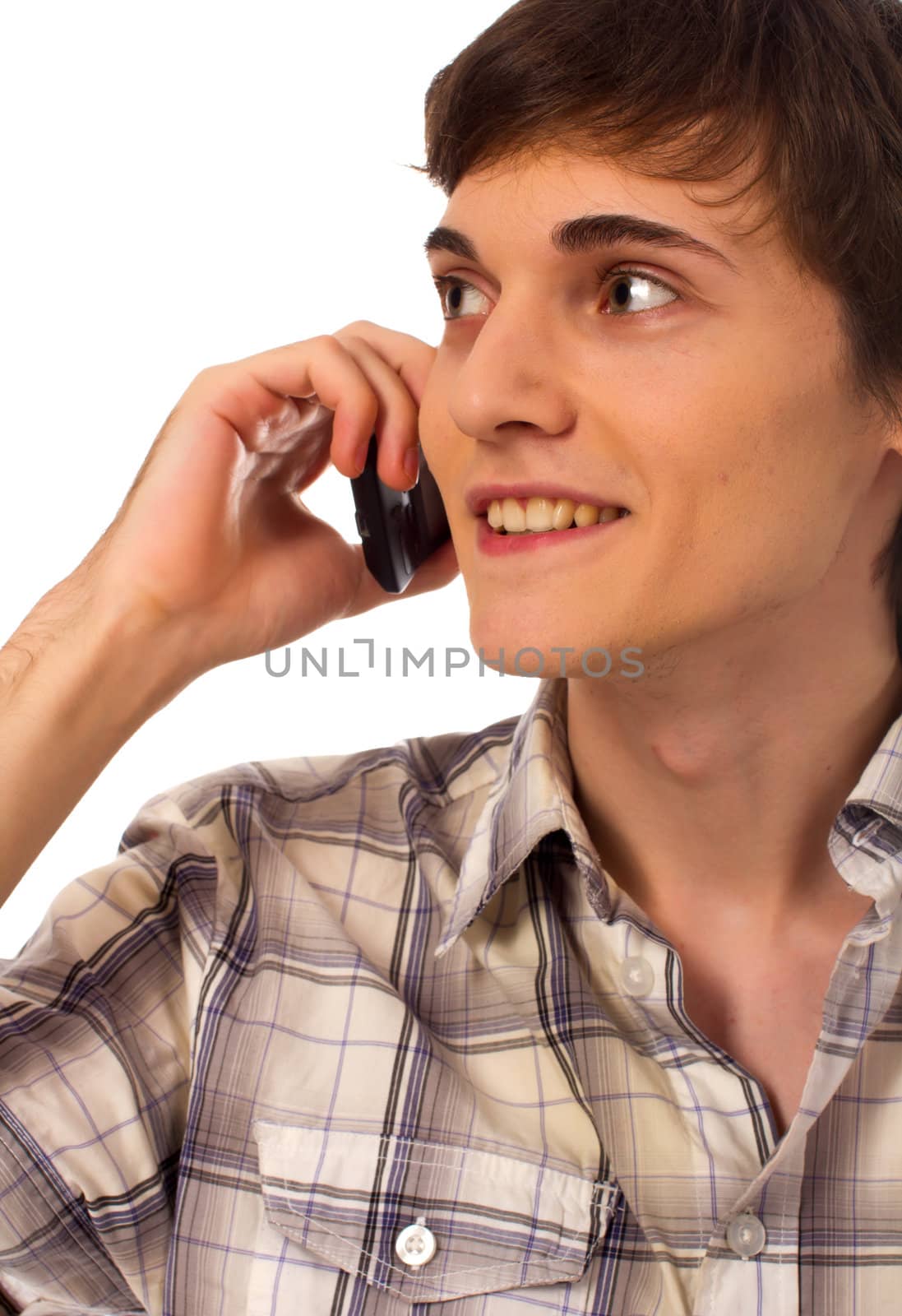 Young male using mobile phone talking on white background