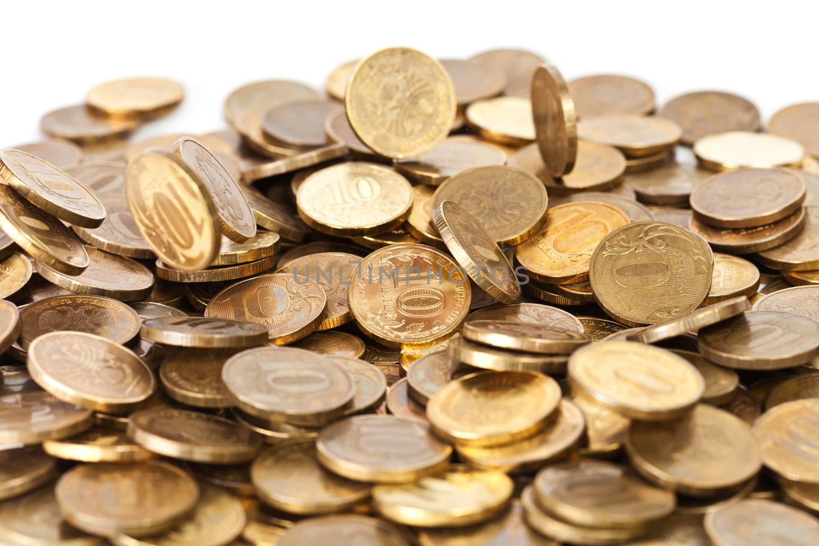 Shiny golden coins falling on white background