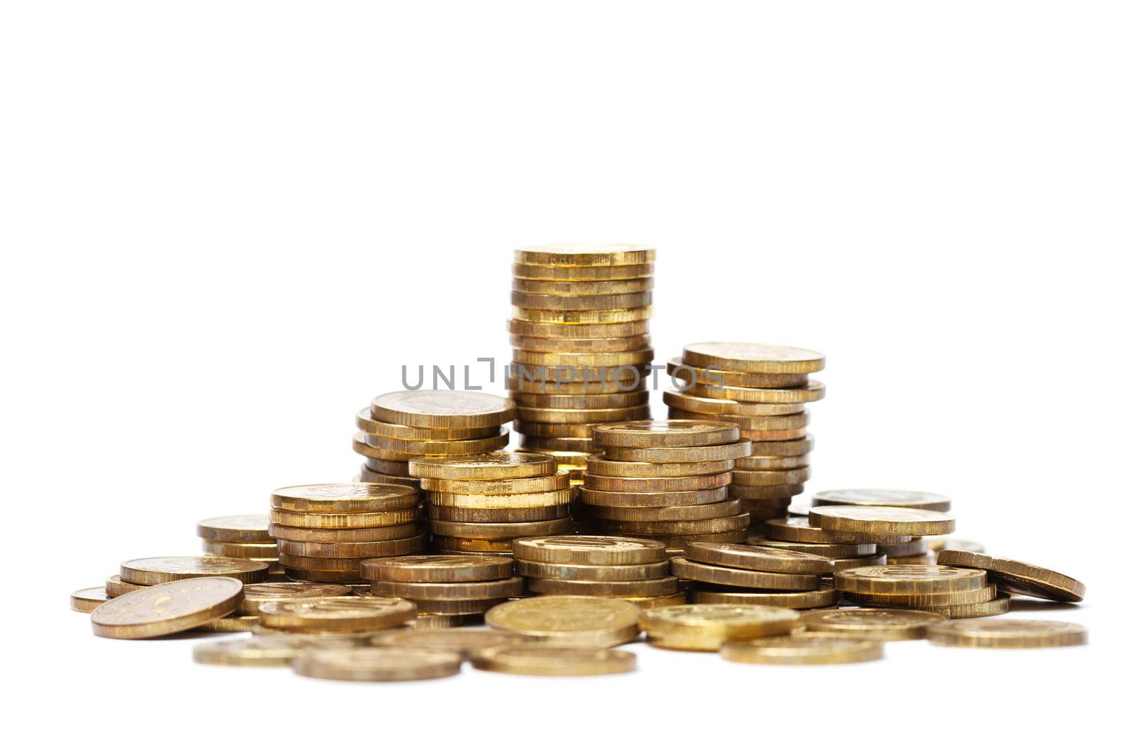 Pile and stacks of golden coins on white background
