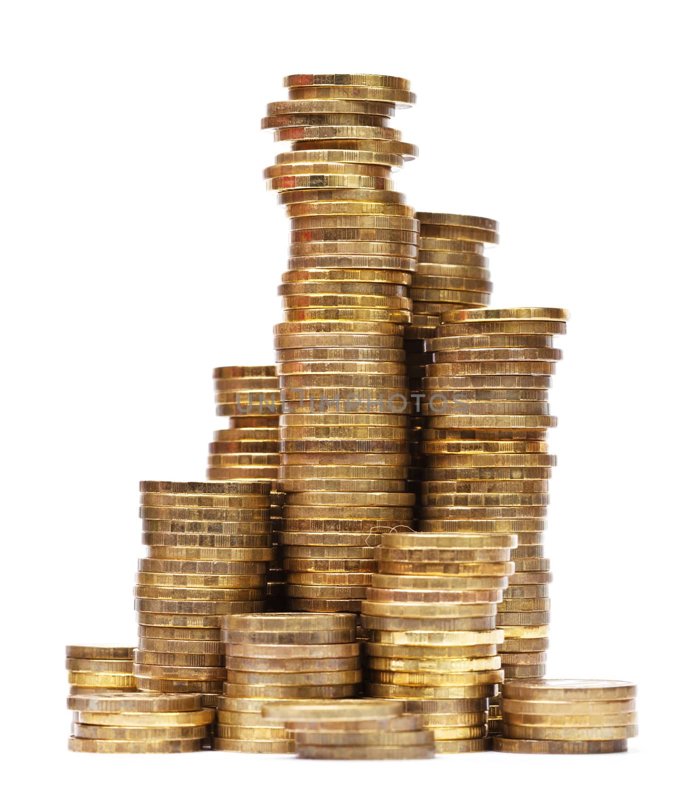 Stacks of golden coins on white background