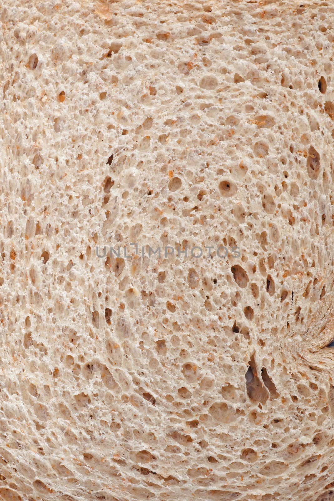 closeup of slice of light brown bread by ahavelaar