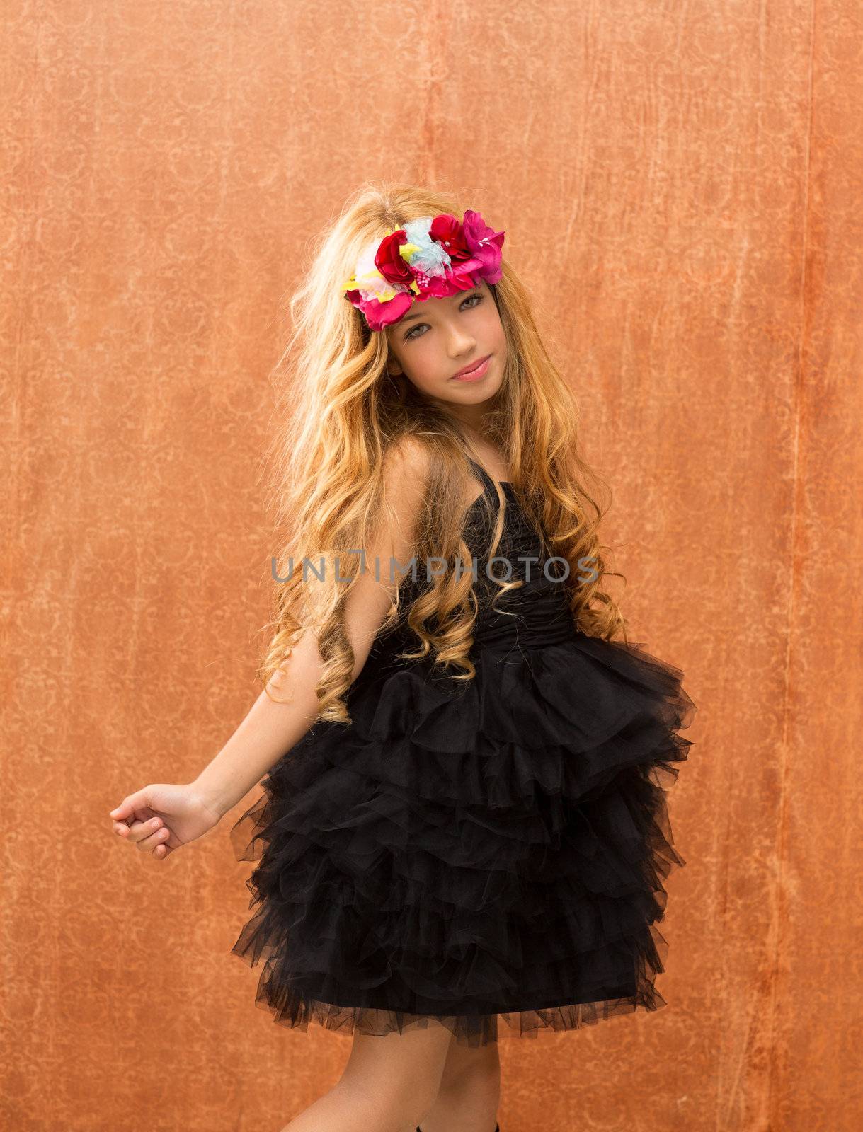 black dress kid girl dancing and on retro vintage background