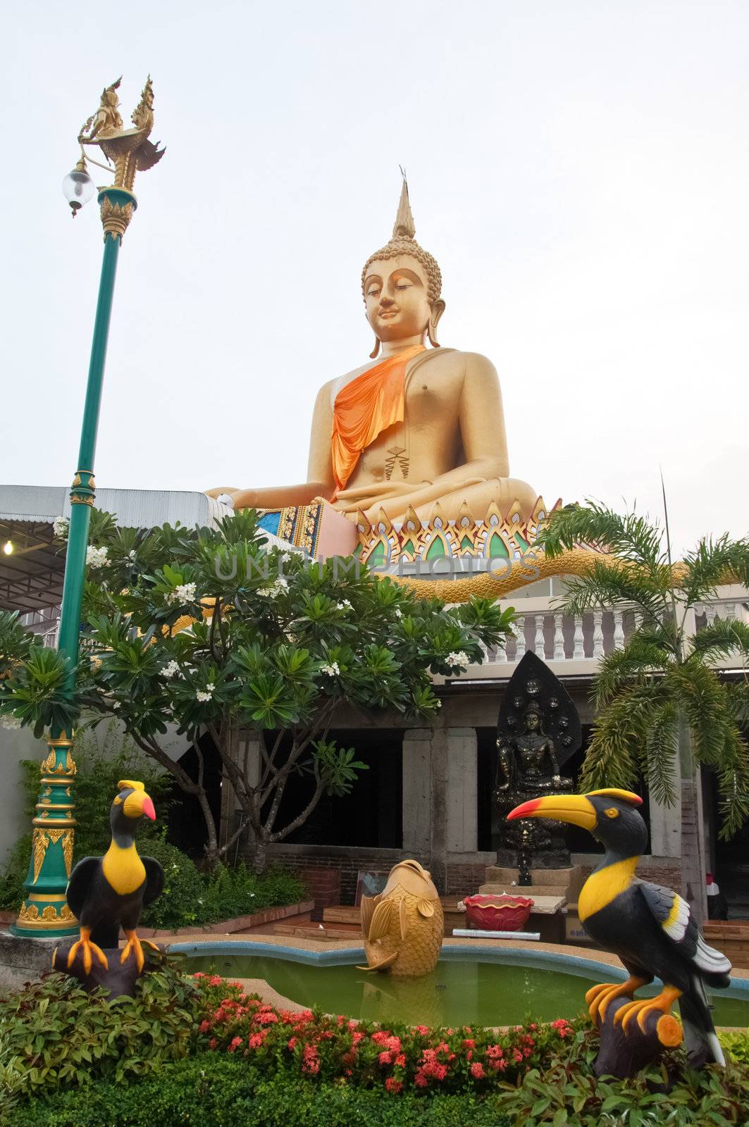 The big buddha statue sitting outdoor at Lanna temple, Pathumtani Thailand