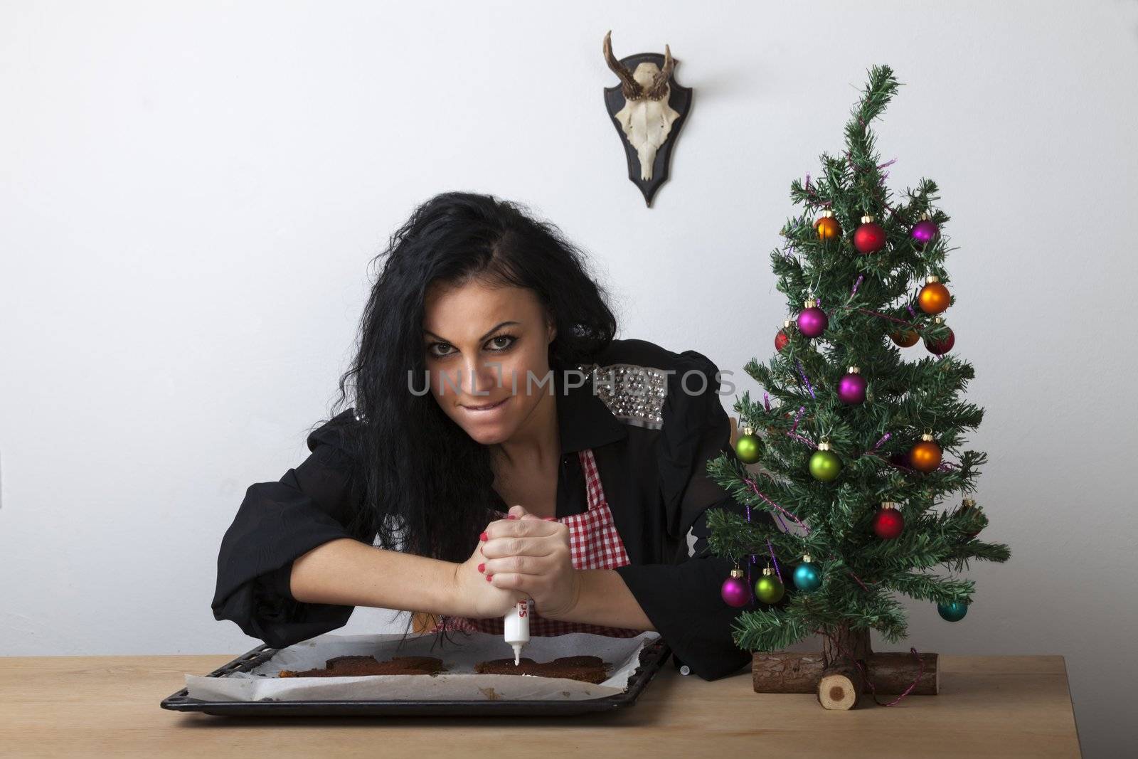 woman in a kitchen with gingerbread by bernjuer