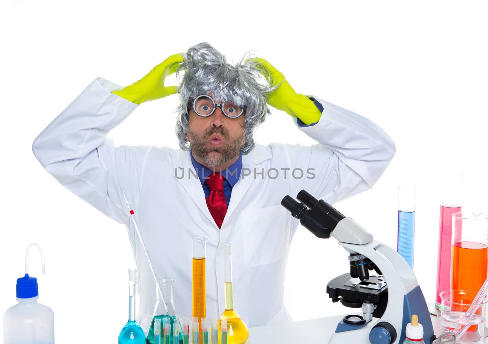 Crazy mad nerd scientist funny expression at laboratory on chemical experiment