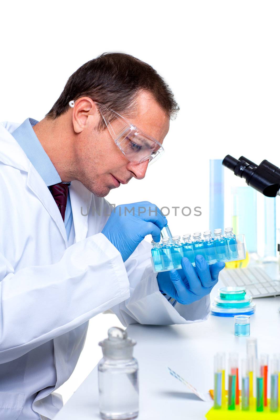 laboratory scientist working at lab with test tubes and microscope
