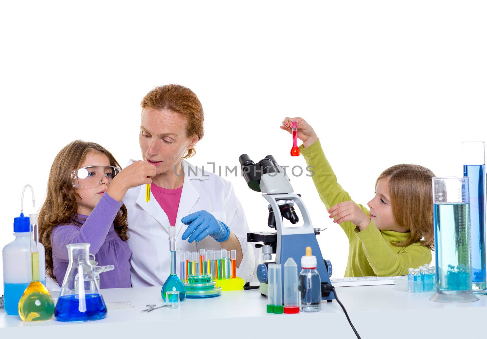 children girls and teacher woman at laboratory on school chemical class
