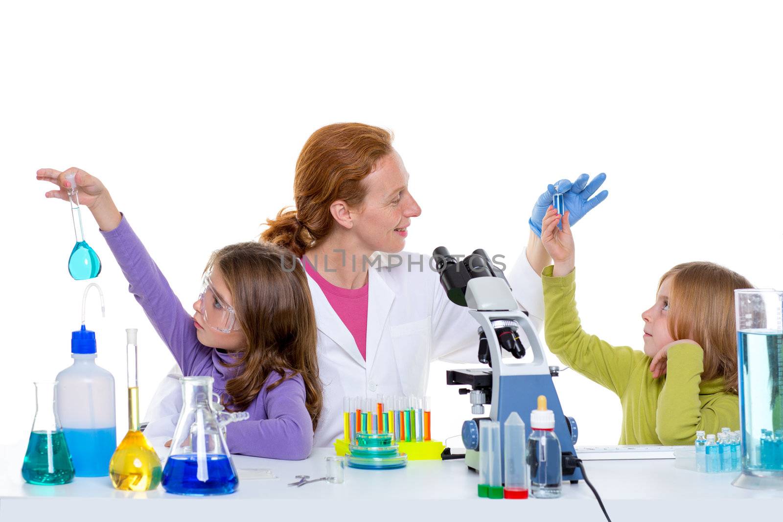 children girls and teacher woman at laboratory on school chemical class