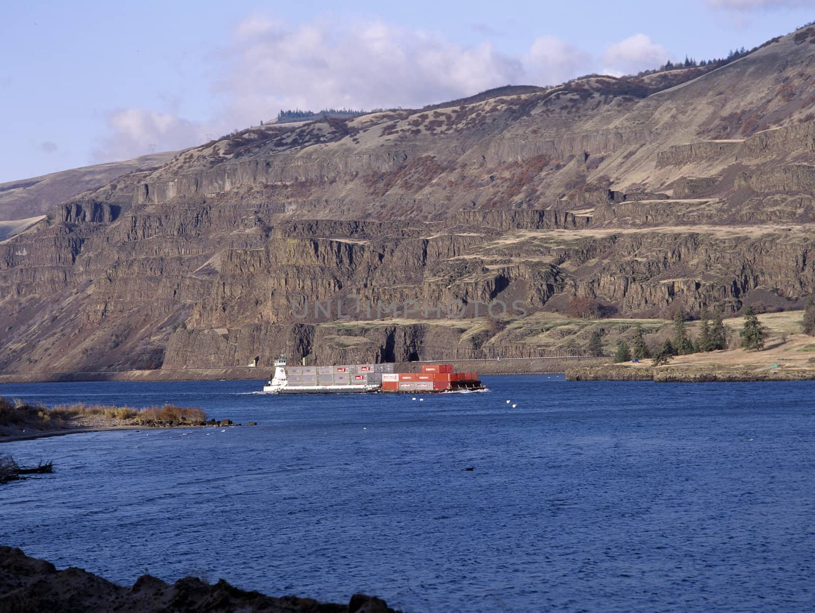 Red barge on the Columbia River, Oregon by RUSSELLIMAGES