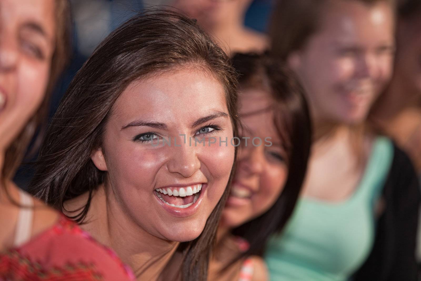 Close up of laughing Caucasian teenage girls outdoors