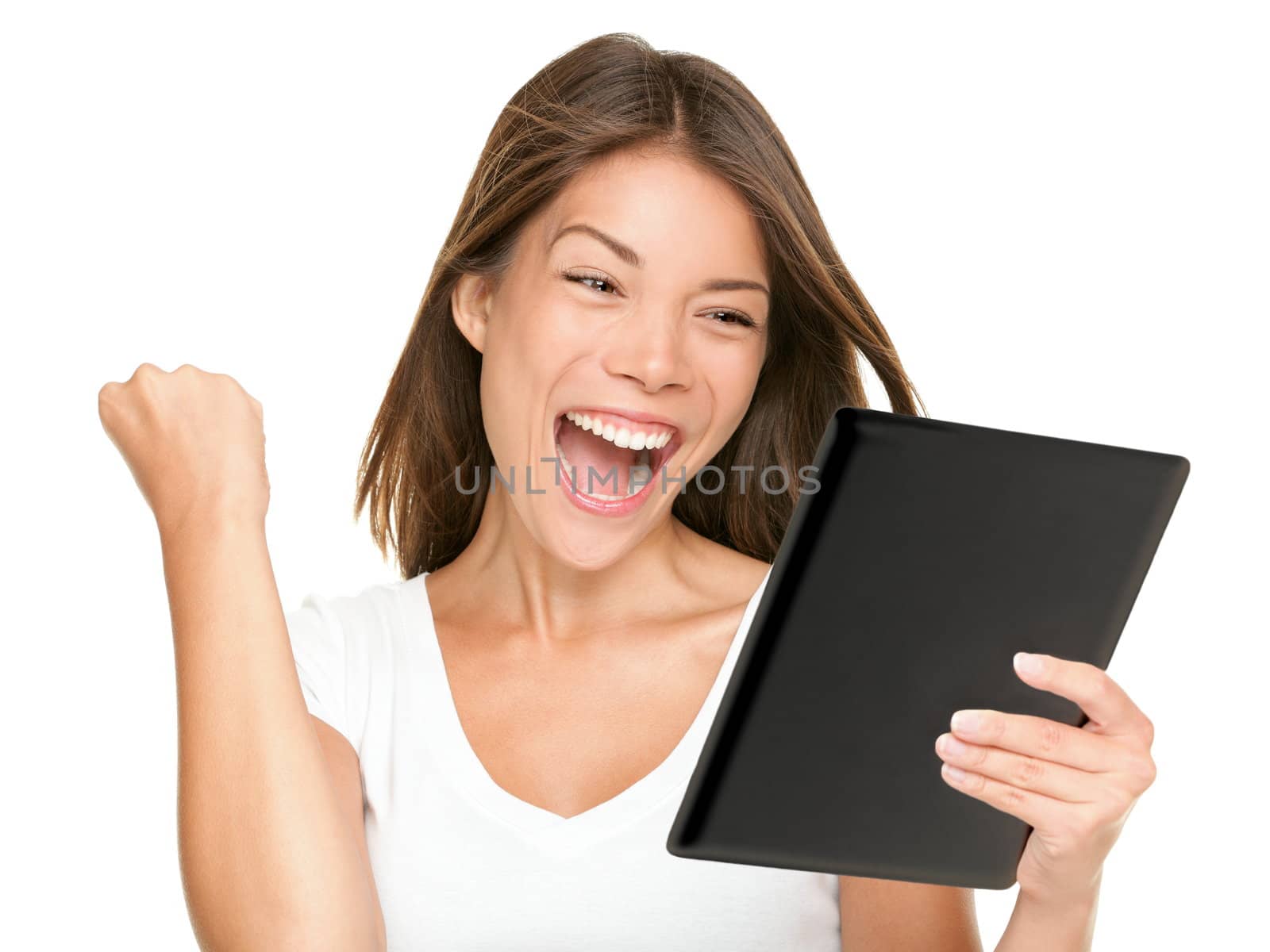 Tablet computer woman winning happy excited by Ariwasabi