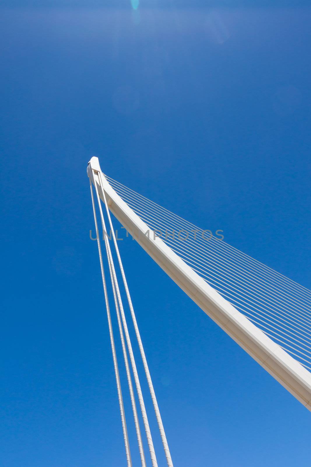 Suspension bridge with cables reaching to the deck of the bridge from the columns