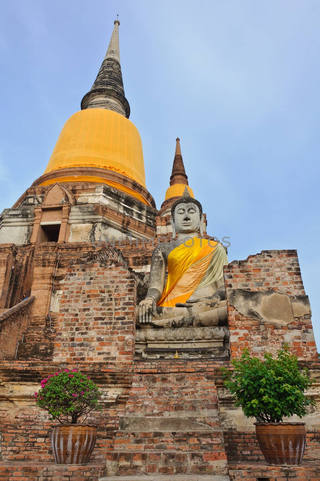 The big ancient buddha statue in ruined old temple at Wat Yai Chai Mongkol temple, Ayutthaya, Thailand