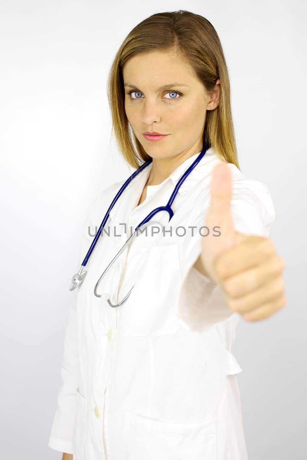 Serious woman doctor thumb up isolated