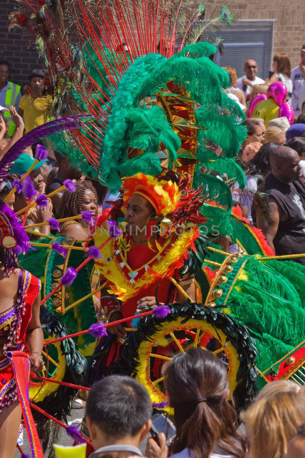 BRISTOL, ENGLAND - JULY 3: Participant and spectators at the St Pauls "Afrikan-Caribbean" carnival in Bristol, England on July 3, 2010. A record 70,000 people attended the 42nd running of the annual event