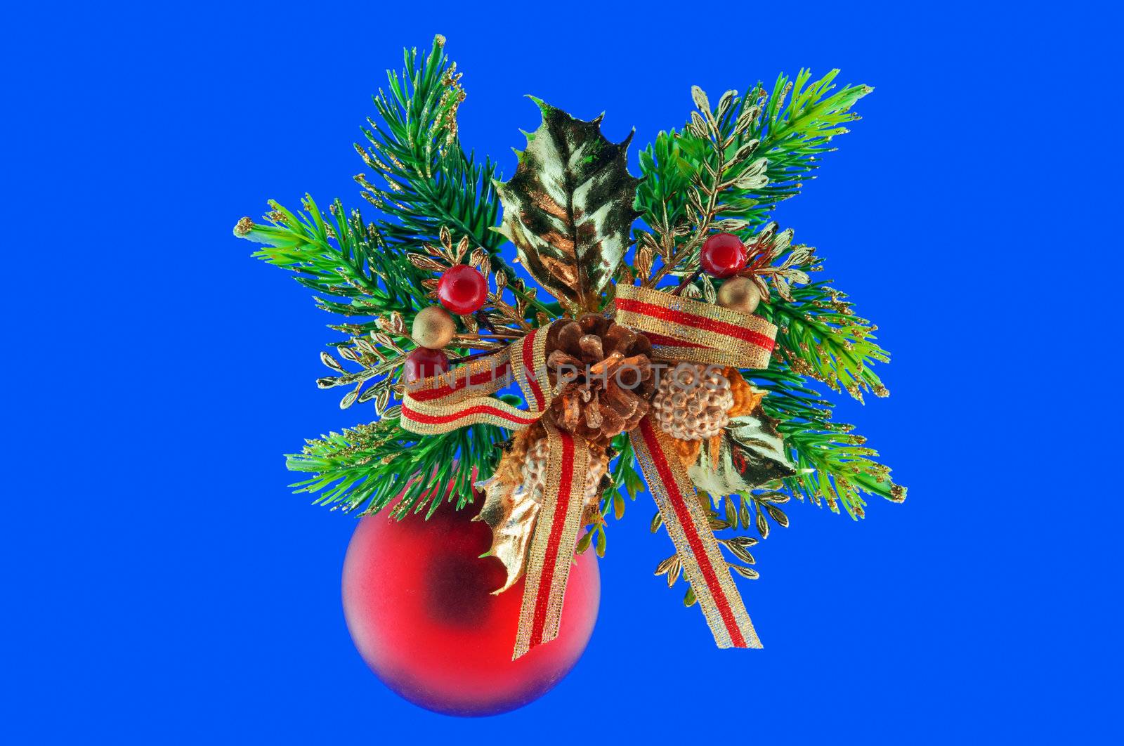 red ball, cone spruce, fir and sprigs to decorate for Christmas against a blue background
