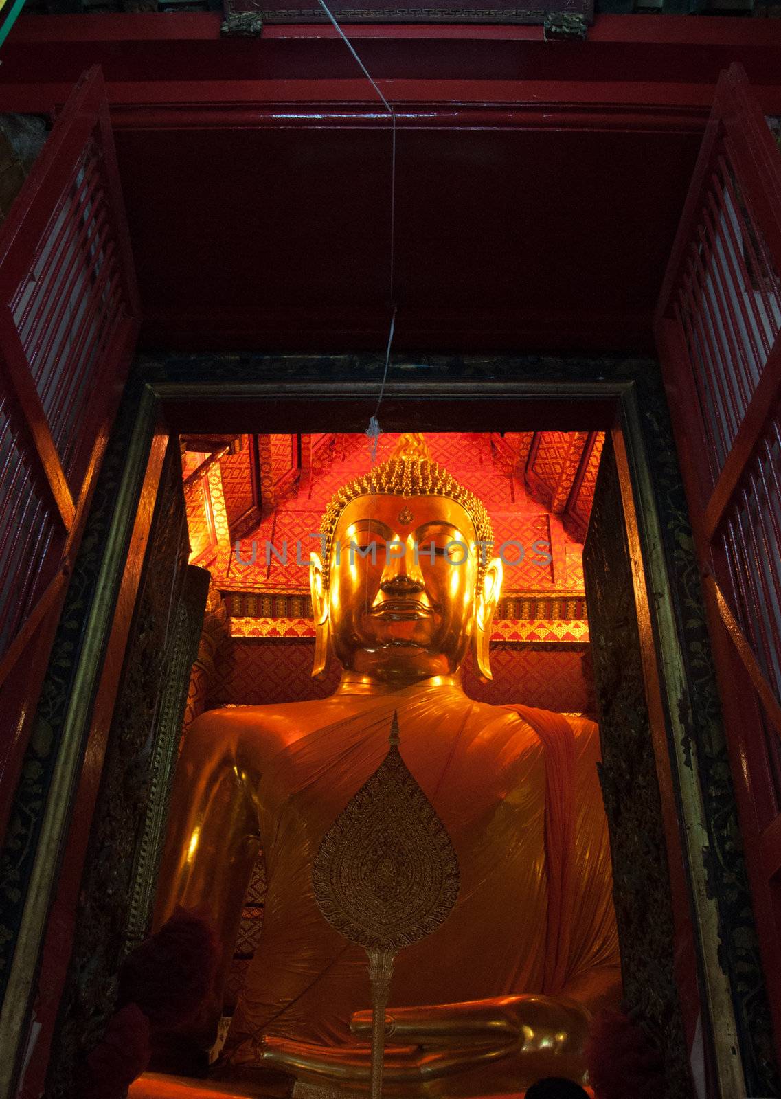 Big gold Buddha statue at Wat Pha Nan Cherng temple belonging to the public, Ayutthaya, Thailand