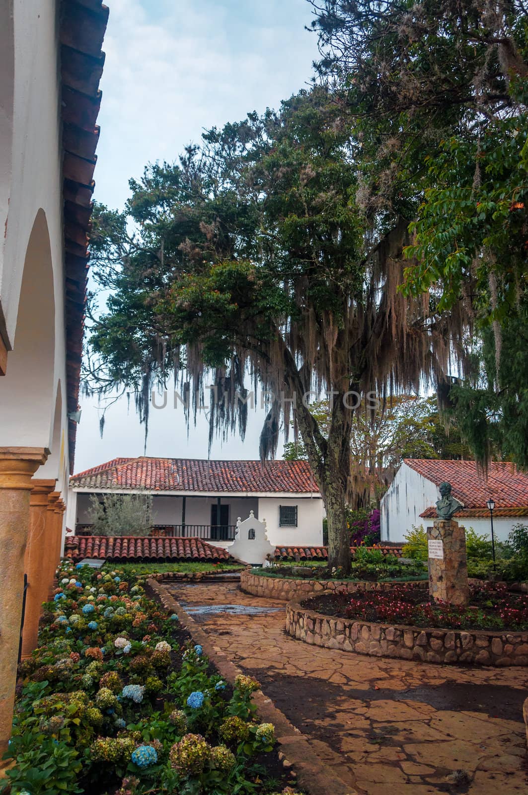 Beautiful courtyard of a white and sandstone monastery in Villa de Leyva, Colombia