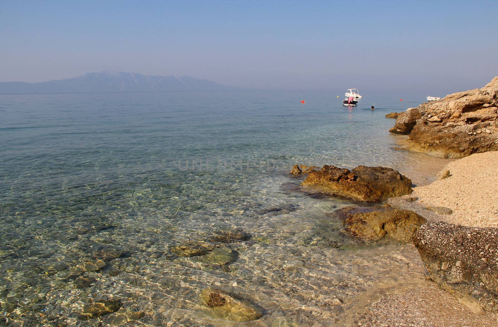 Clear sea water of Adriatic sea and small boat, Croatia