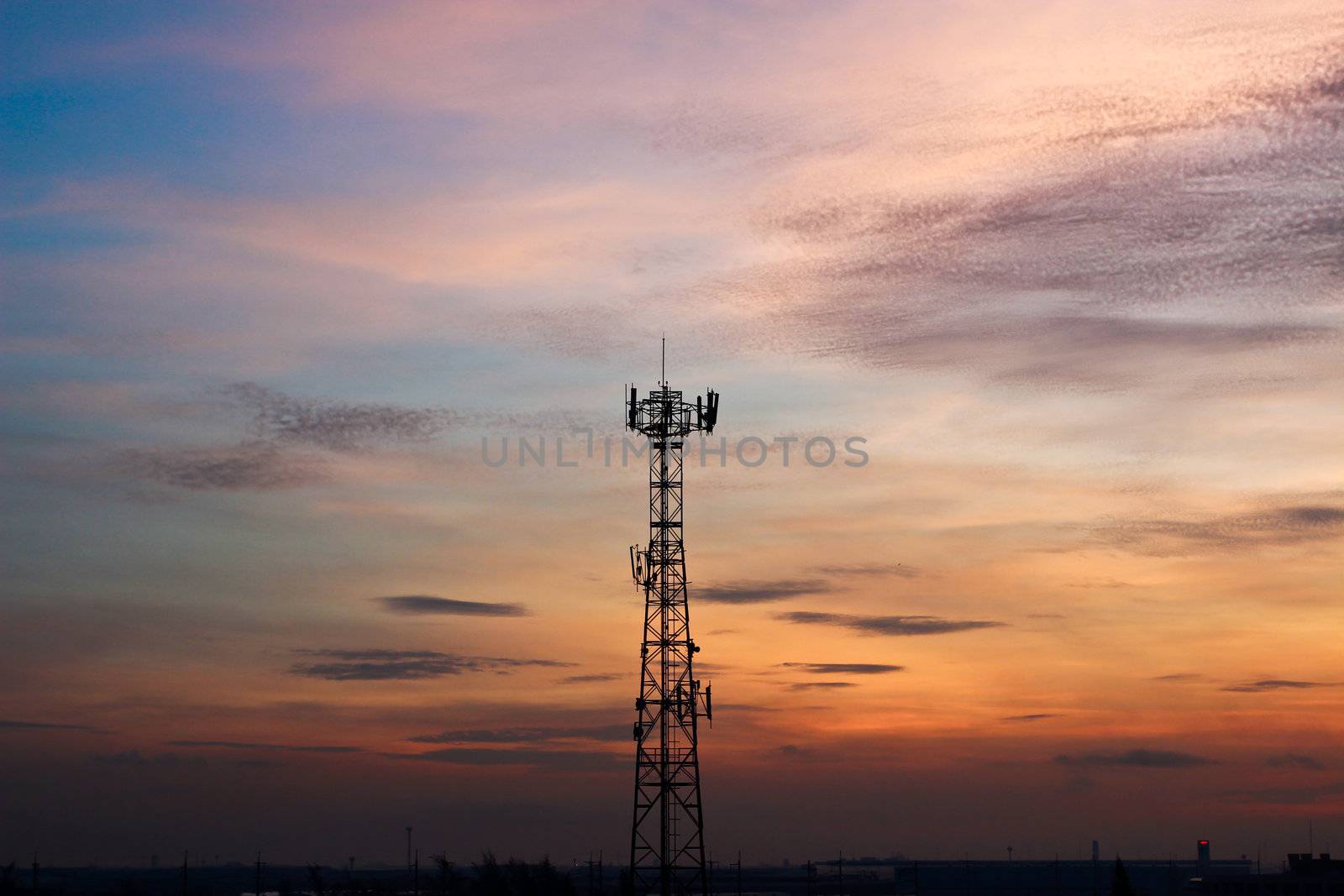 Modern cell and antenna with flat parabola on Sunset