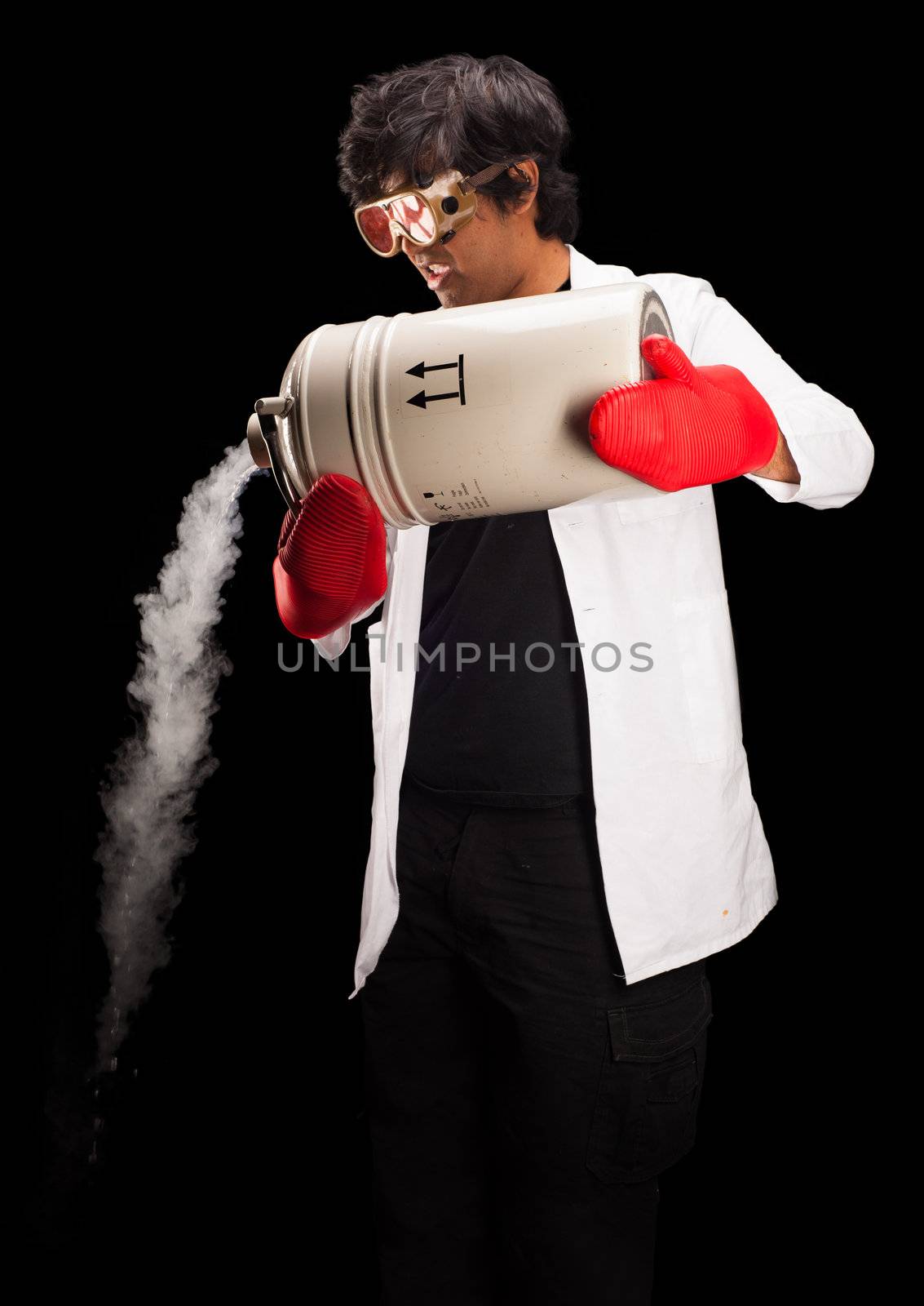 Male scientist pouring from a dewar of liquid nitrogen