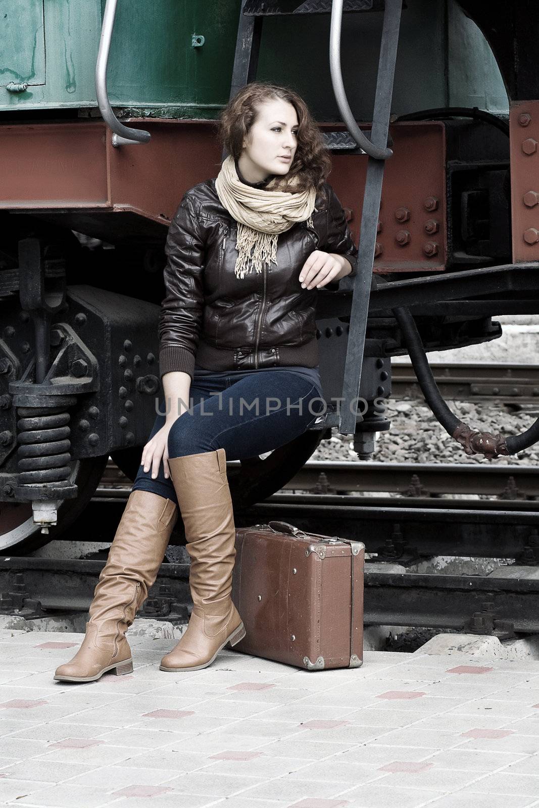 girl waiting for landing on the platform in the vintage train