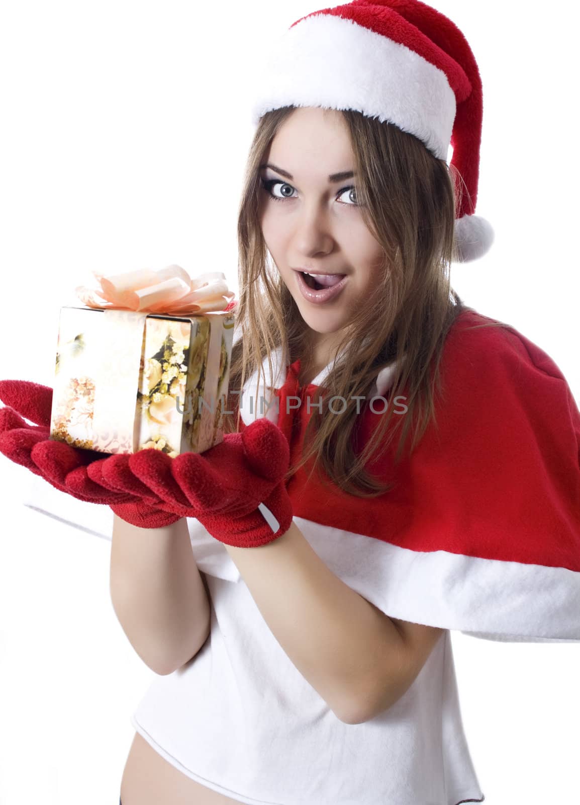 Standing indoors and holding christmas gift