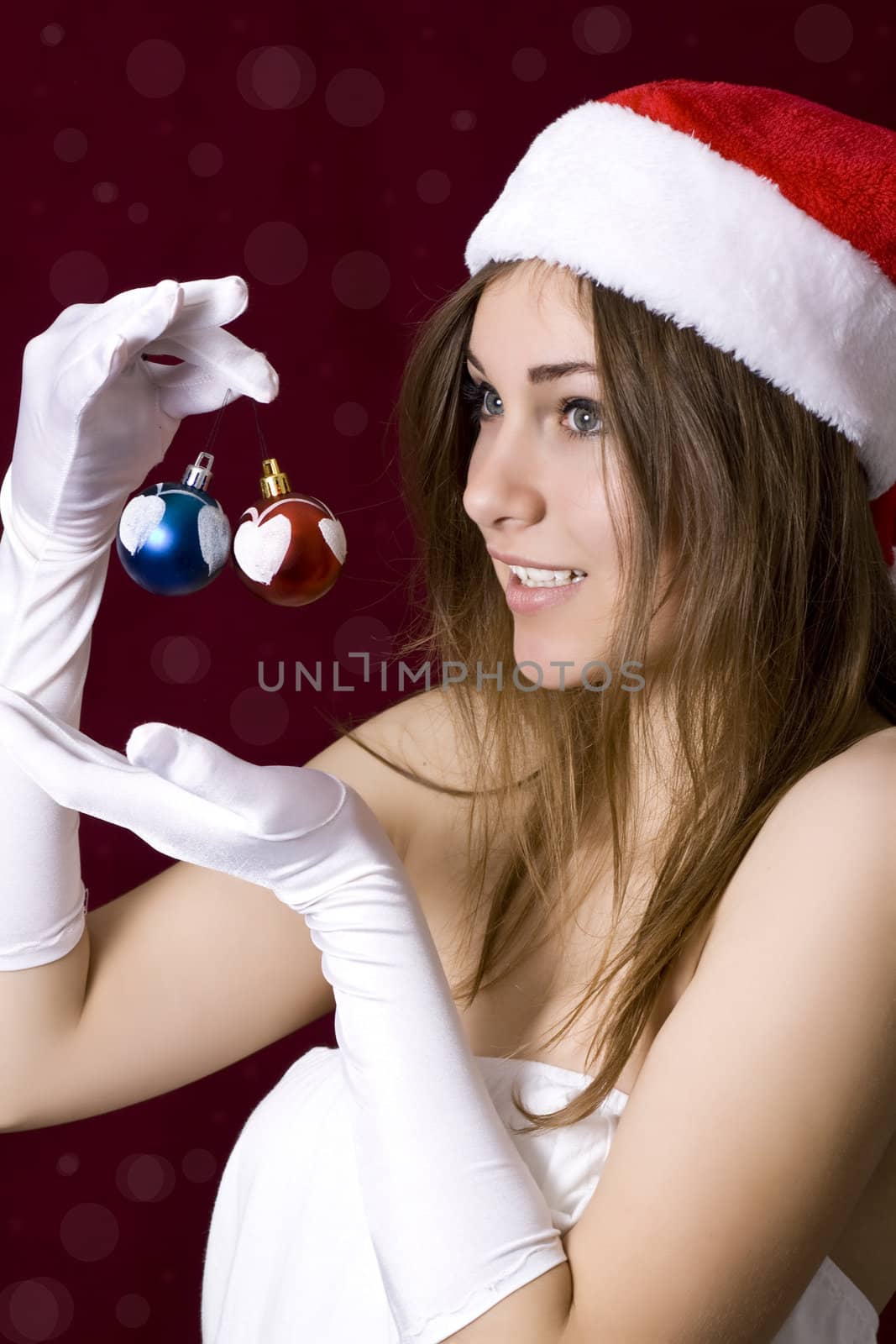 Beautiful woman in Christmas hand with christmass toys