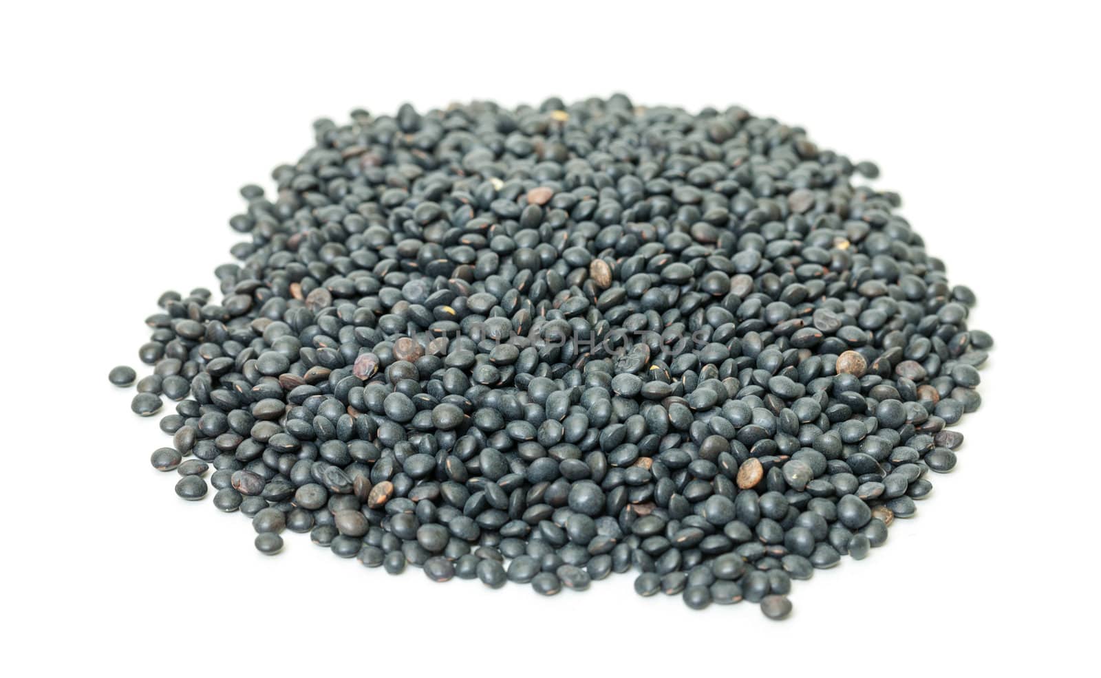 Heap of black lentil, isolated on white background