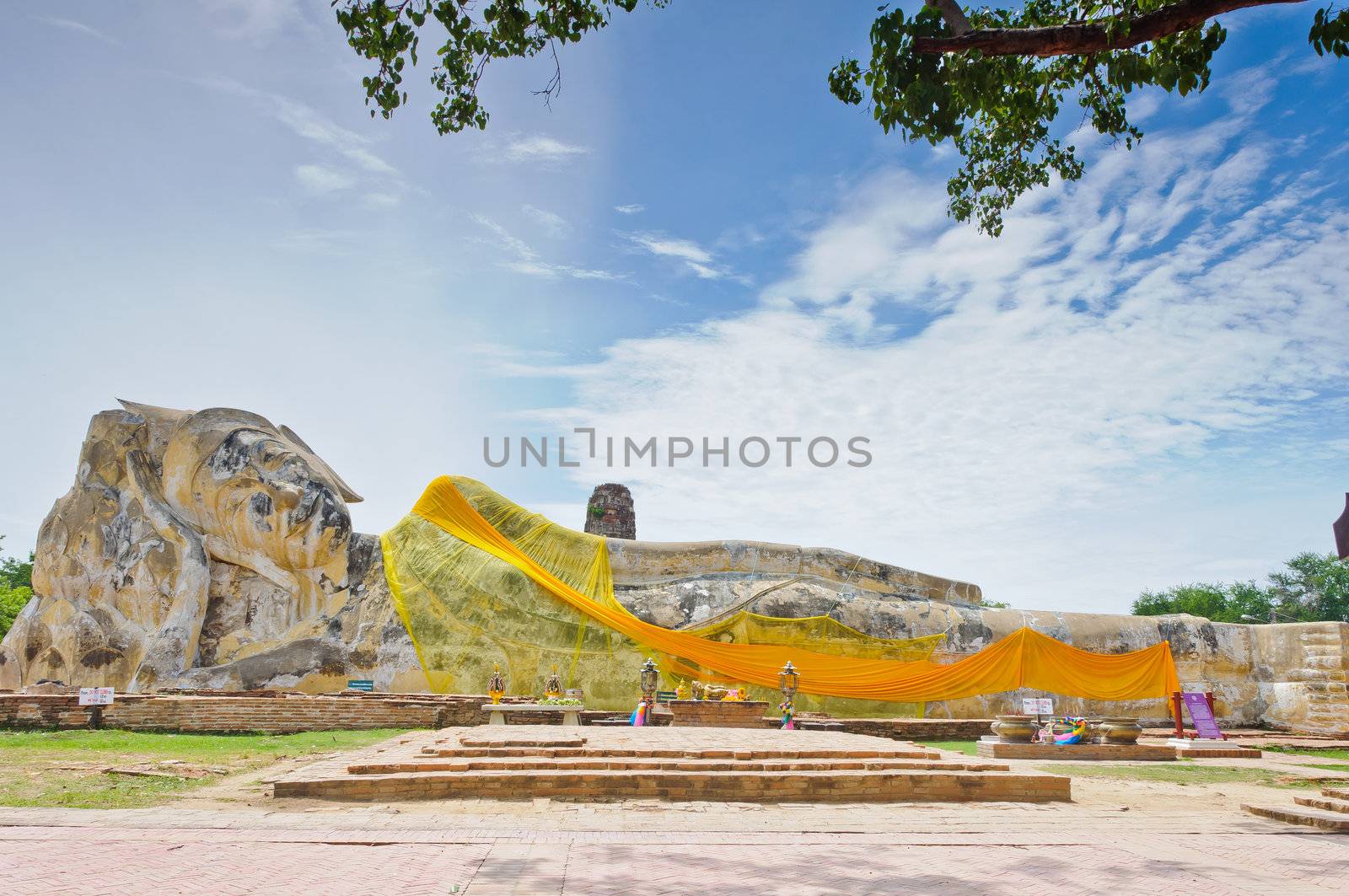 Ancient sleeping buddha statue at Wat Lo Ka Ya Su Tha temple in Ayutthaya, Thailand