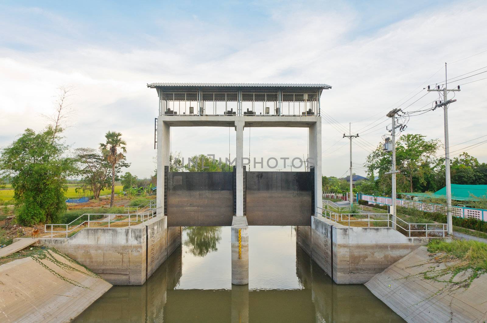 Water and dam gate in an irrigation canal, countryside of Pathumtanee, Thailand