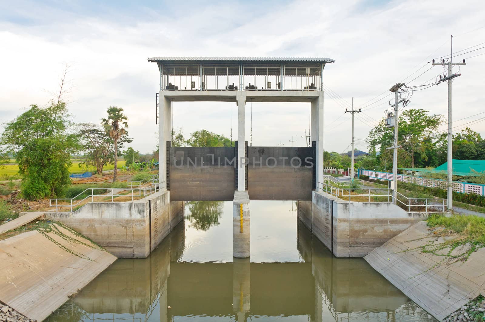 Water and dam gate in an irrigation canal, countryside of Pathumtanee, Thailand