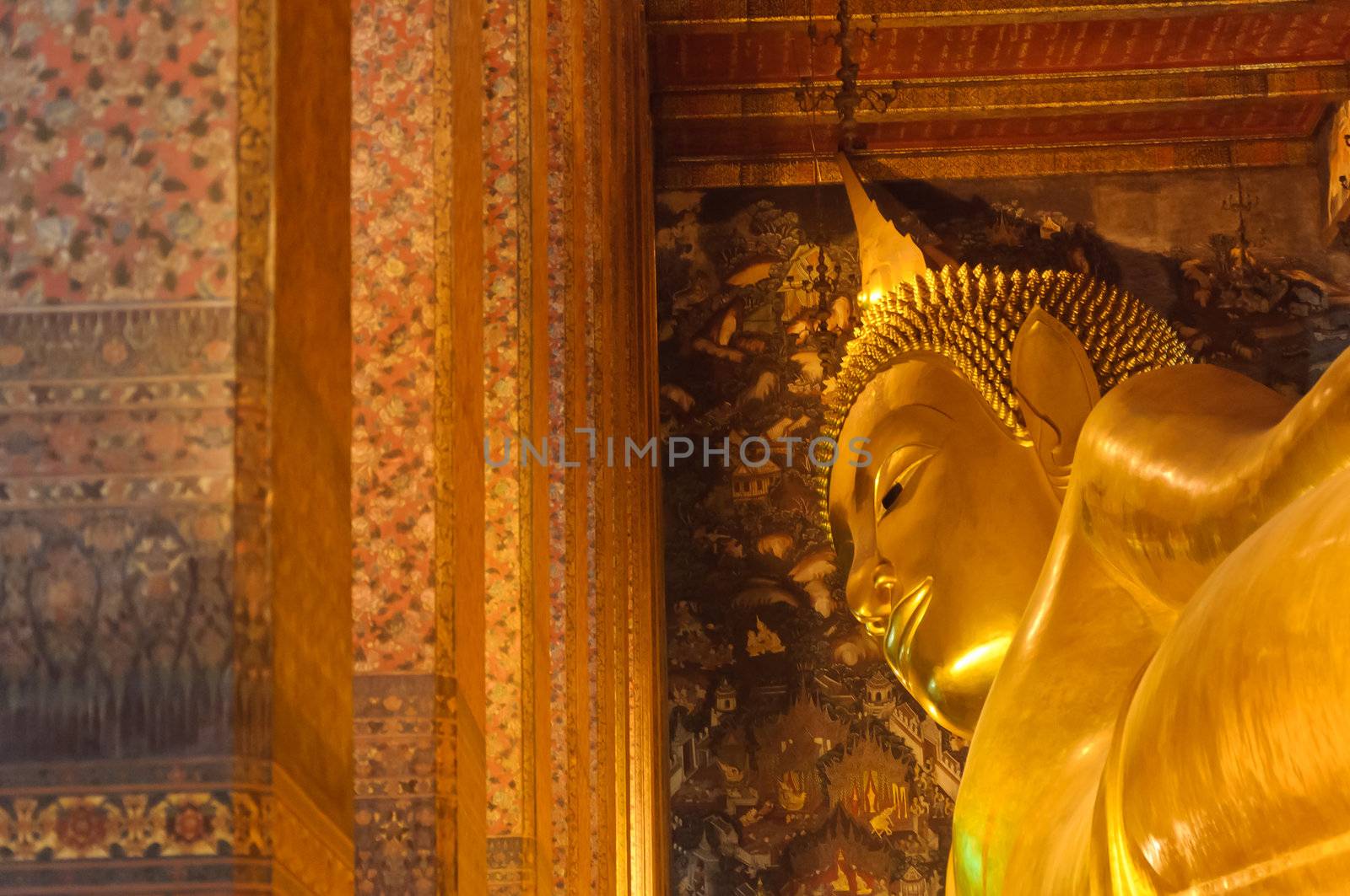 Face of reclining buddha statue at Wat Pho temple public place, Bangkok, Thailand